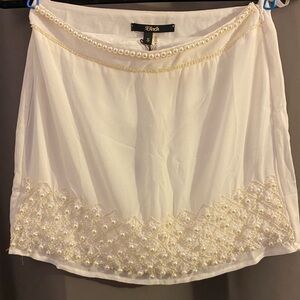 Cream colored skirt with faux pearl accents
